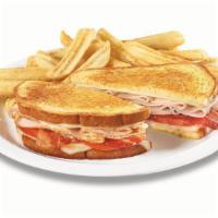 The Super Bird® · Turkey breast with Swiss cheese, bacon and tomato on grilled sourdough. Served with wavy-cut...