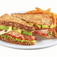 Cali Club Sandwich · Turkey breast, ham, bacon, Swiss cheese, fresh avocado, sun-dried tomato mayo, lettuce and t...
