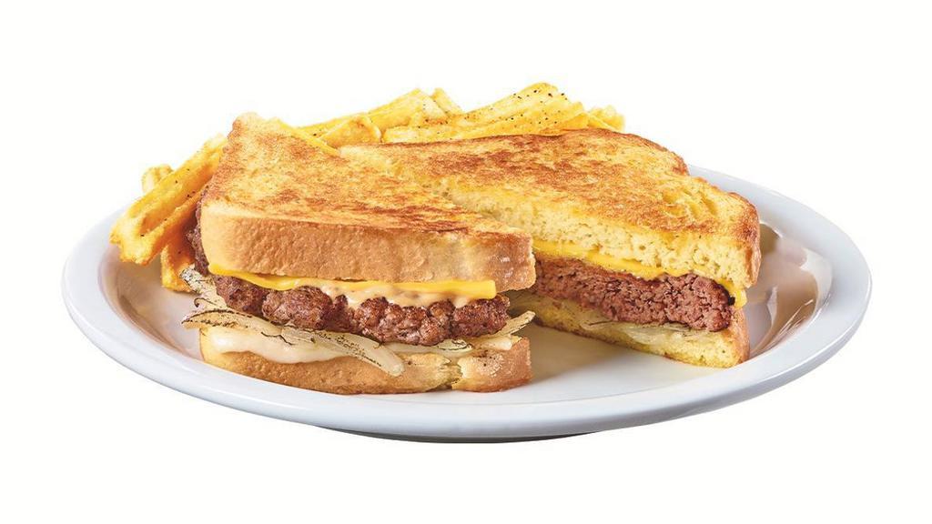Diner Classic Patty Melt · A 100% beef patty with caramelized onions, Swiss & American cheeses and Diner Q sauce on grilled potato bread. Served with wavy-cut fries.