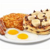 Choconana Pancake Breakfast  · Ghirardelli® chocolate chips cooked inside buttermilk pancakes and topped with bananas and m...