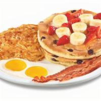 Clearly Fruity Pancake Breakfast · Buttermilk pancakes cooked with blueberries and topped with strawberries and bananas. Drizzl...
