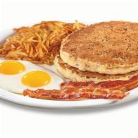 Hearty 9-Grain Pancake Breakfast  · Multigrain wheat pancakes made with flaxseeds, cinnamon & brown sugar. Served with eggs,* ha...