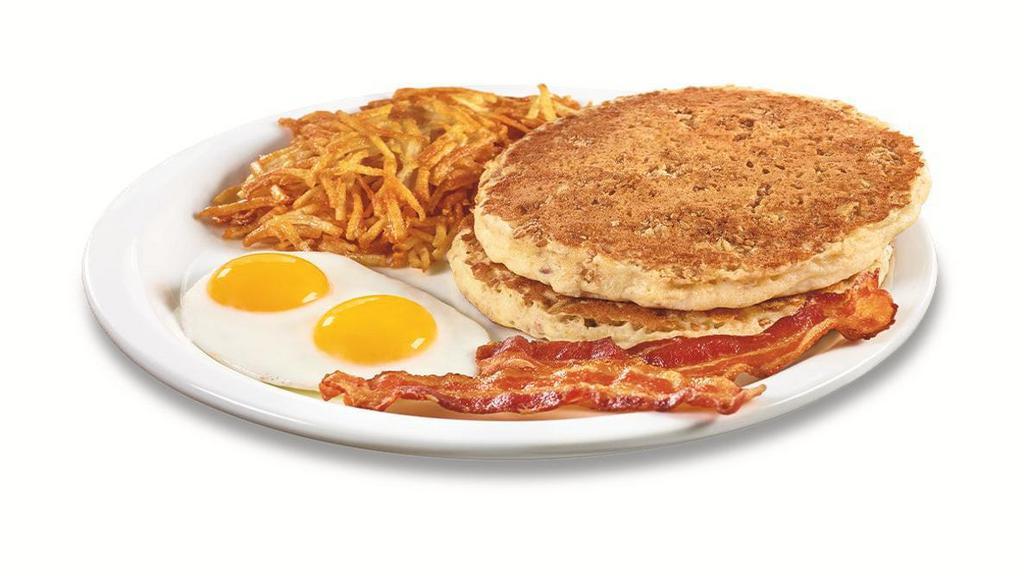 Hearty 9-Grain Pancake Breakfast  · Multigrain wheat pancakes made with flaxseeds, cinnamon & brown sugar. Served with eggs,* hash browns, plus bacon strips or sausage links.