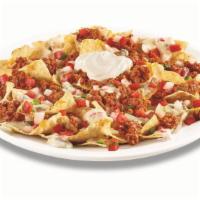 Zesty Nachos · Tortilla chips freshly cooked and topped with Pepper Jack queso, cheddar cheese, seasoned na...
