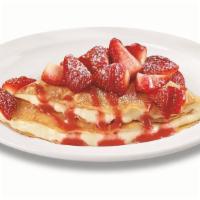 Strawberry Vanilla Crepe · Folded with vanilla cream and topped with fresh seasonal berries, strawberry sauce and powde...