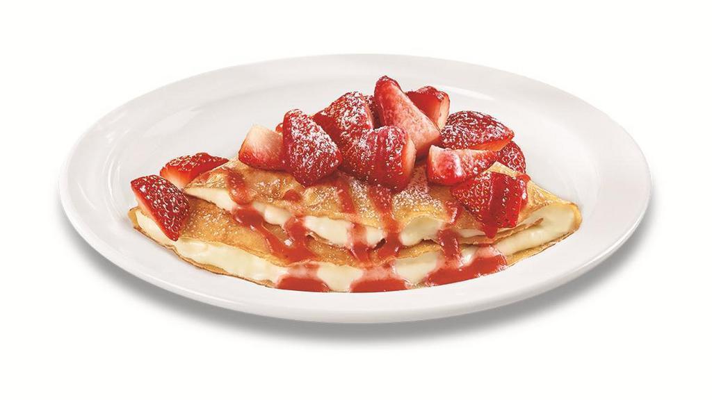 Strawberry Vanilla Crepe · Folded with vanilla cream and topped with fresh seasonal berries, strawberry sauce and powdered sugar.. Berry selection based on seasonality..