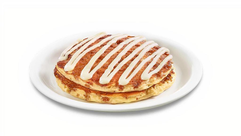Stack Of Cinnamon Roll Pancakes  · Buttermilk pancakes cooked with cinnamon crumb topping and topped with cream cheese icing.