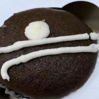 Filled Cupcake  · Dark chocolate cupcake filled with non-dairy Vanilla cream and decorated with a simple desig...