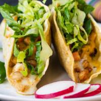 Crispy Tacos · Crispy corn tortillas stuffed with your choice of filling, guacamole, cheese, spicy salsa de...