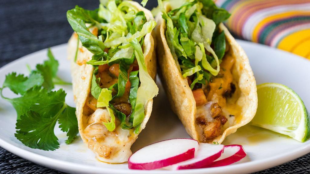 Crispy Tacos · Crispy corn tortillas stuffed with your choice of filling, guacamole, cheese, spicy salsa de arbol, salsa fresca and lettuce.