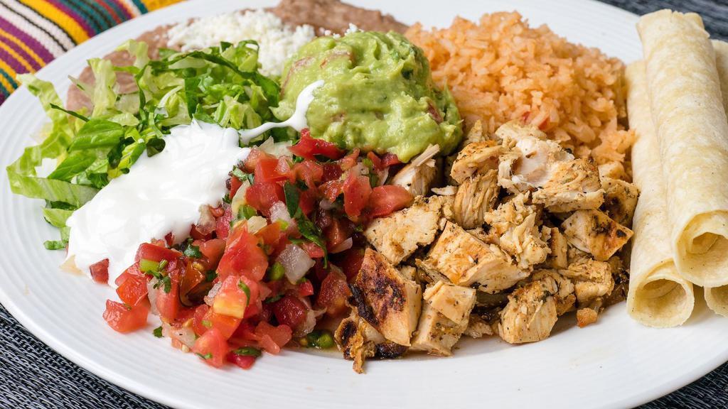 Plates · Generous serving of your choice of filling with beans, rice, salsa fresca, cheese, lettuce, Mexican cream, and guacamole. Served with warm corn tortillas on the side.