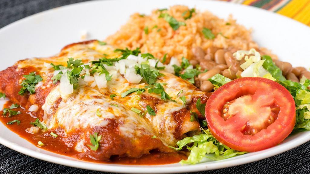 Enchiladas · Three corn tortillas stuffed with your choice of filling and topped with either red Chile or tomatillo-green Chile sauce and melted cheese.