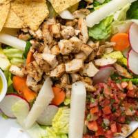 Casa Salad · House salad of chopped romaine, radishes, jicama, carrots, salsa fresca, and chips, with cho...