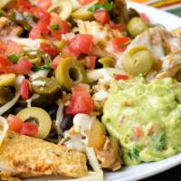 Nachos · Cactus chips with melted cheese, beans, salsa fresca, guacamole, green olives and pickled ja...