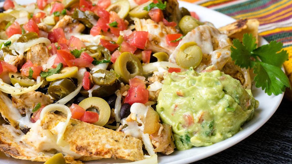 Nachos · Cactus chips with melted cheese, beans, salsa fresca, guacamole, green olives and pickled jalapeños.