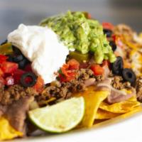 Super Nachos · house made chips, refried beans, melted cheese, pico de Gallo, sour cream and guacamole. ( n...