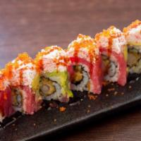 75. Red Dragon · Shrimp tempura, cucumber, tuna, avocado topped with crab meat & tobiko.