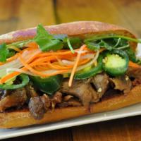 F1. BBQ Pork Sandwich · All include pickled carrots & Dalkon, cucumber, cilantro, jalapenos and mayo on a fresh bagu...