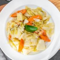 Atakilt Wot · Vegetarian. Vegan. Cabbage, potato and carrot simmered in wild sauce with ginger, garlic, on...