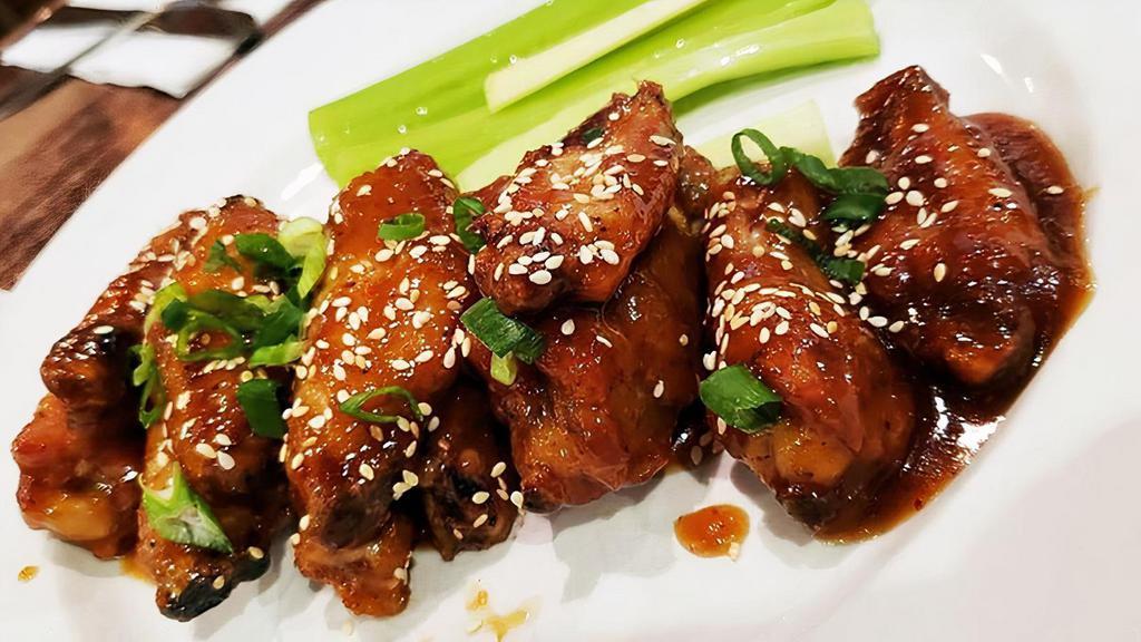 ASIAN WINGS · With sweet and spicy glaze, green onion, sesame seeds