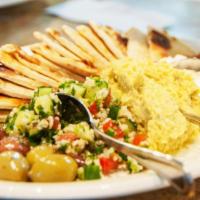 MEDITERRANEAN SAMPLER · Tzatziki, cilantro-jalapeno hummus, tabouli, marinated olives, warm pita bread