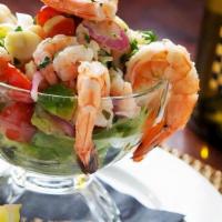 PRAWN COCKTAIL · Tiger prawns, salad of bay shrimp, hearts of palm, avocado, cherry tomatoes, red onion, cila...