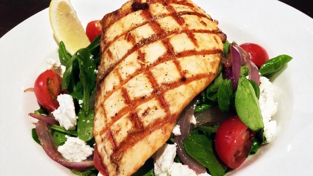 GRILLED SALMON SALAD · Grilled Salmon, baby spinach, grilled onions, cherry tomatoes, feta cheese, house vinaigrette