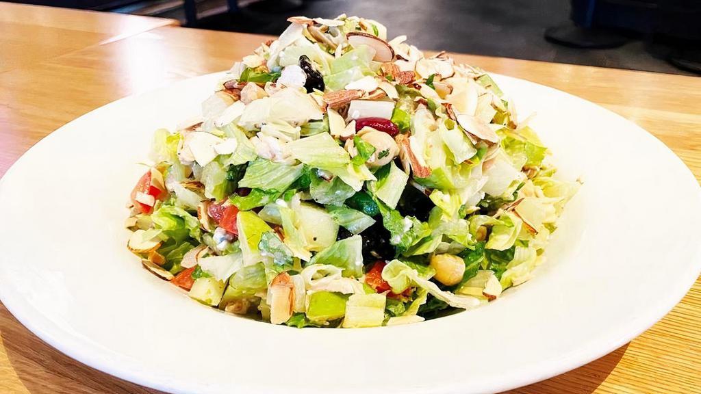 CHOPPED CHICKEN SALAD · Romaine lettuce, grilled chicken, granny smith apples, hearts of palm, dried cherries, kidney beans, garbanzo beans, tomatoes, gorgonzola cheese, house vinaigrette