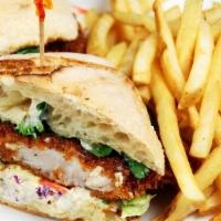 CATFISH PO' BOY · dipped in beer batter and panko crusted, coleslaw, cilantro, tartar sauce on ciabatta