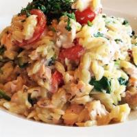 ORZO SALMON · Grilled Salmon tossed with orzo pasta, cherry tomatoes, baby spinach, fresh dill, lemon, whi...