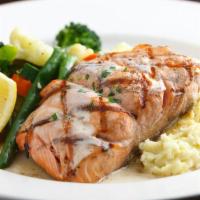 GRILLED SALMON · With lemon-butter sauce and choice of two sides.