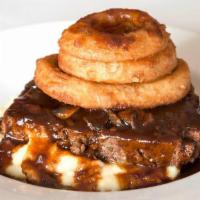 MAMA ELENI'S MEATLOAF · all-natural angus beef, yukon gold mashed potatoes, mushroom gravy, crispy onion rings