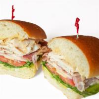 Beach Boy · Hot turkey, prosciutto, Swiss and avocado with spicy ranch, mayo, shredded lettuce, tomatoes...