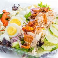 Cobb Salad · Chicken, bacon, hardboiled egg, crumbled blue cheese, tomatoes, onions & cucumbers on mixed ...