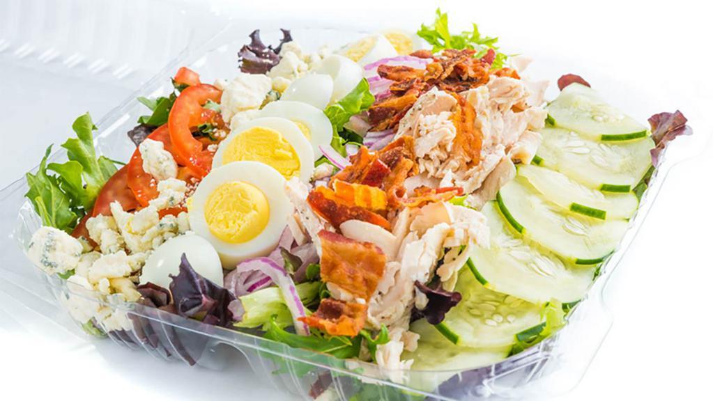Cobb Salad · Chicken, bacon, hard-boiled egg and crumbled blue cheese, tomatoes, onions and cucumbers on mixed greens.