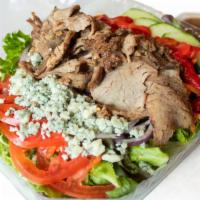Tri Tip Salad · Tri tip with blue cheese crumbles, marinated red bell peppers, tomatoes, onions and cucumber...
