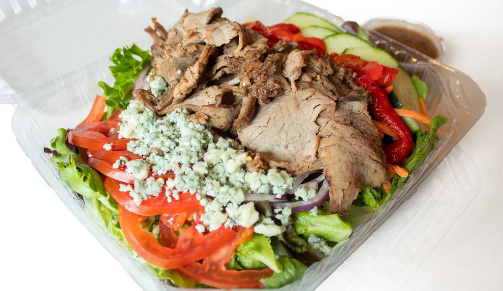 Tri Tip Salad · Tri tip with blue cheese crumbles, marinated red bell peppers, tomatoes, onions and cucumbers on mixed greens.