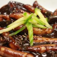 Black Bean Rice Cake · Black bean sauce, onion, zucchini, and green onion with ground pork.