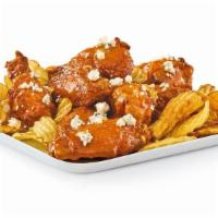 Chicken Wings · Bone-In Chicken Wings with your choice of sauce, served on a bed of Yukon kettle chips.