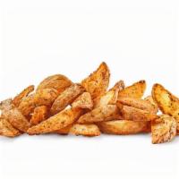 Potato Wedges · Thick-cut potato wedges flavored with sour cream – chive seasoning.