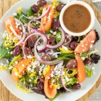 Greek Salad · Lettuce, onions, kalamata olives, tomatoes, Greek peppers, and feta cheese.