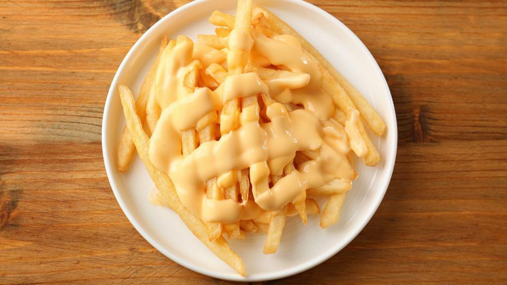 Cheesy French Fries · Crispy potatoes smothered in cheese.