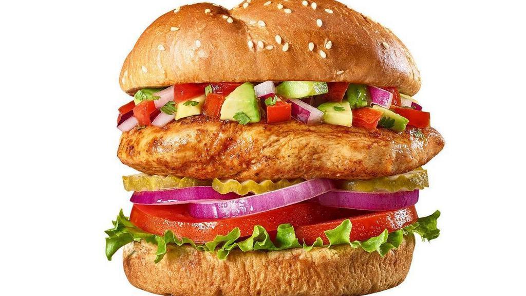 Baja Beach Chicken Burger · A seasoned grilled chicken breast with avocado, pico de gallo, lettuce, tomato, red onions and pickles on a brioche bun.  .