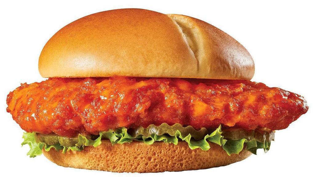 Fire It Up Chicken Burger · A golden-fried chicken breast tossed in buffalo sauce with lettuce and pickles on a split top bun..