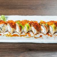 2. Dragon Roll · Shrimp tempura, crab topped with eel, avocado, sauce & tobiko.