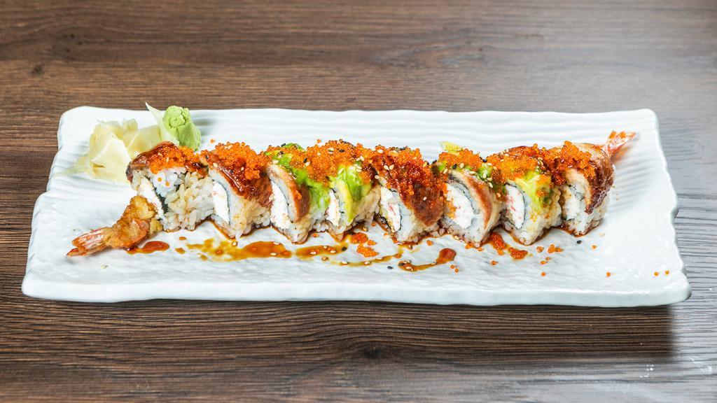2. Dragon Roll · Shrimp tempura, crab topped with eel, avocado, sauce & tobiko.