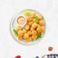 Tot To Ponder · (Vegetarian) Shredded Idaho potatoes formed into tots, battered, and fried until golden brow...