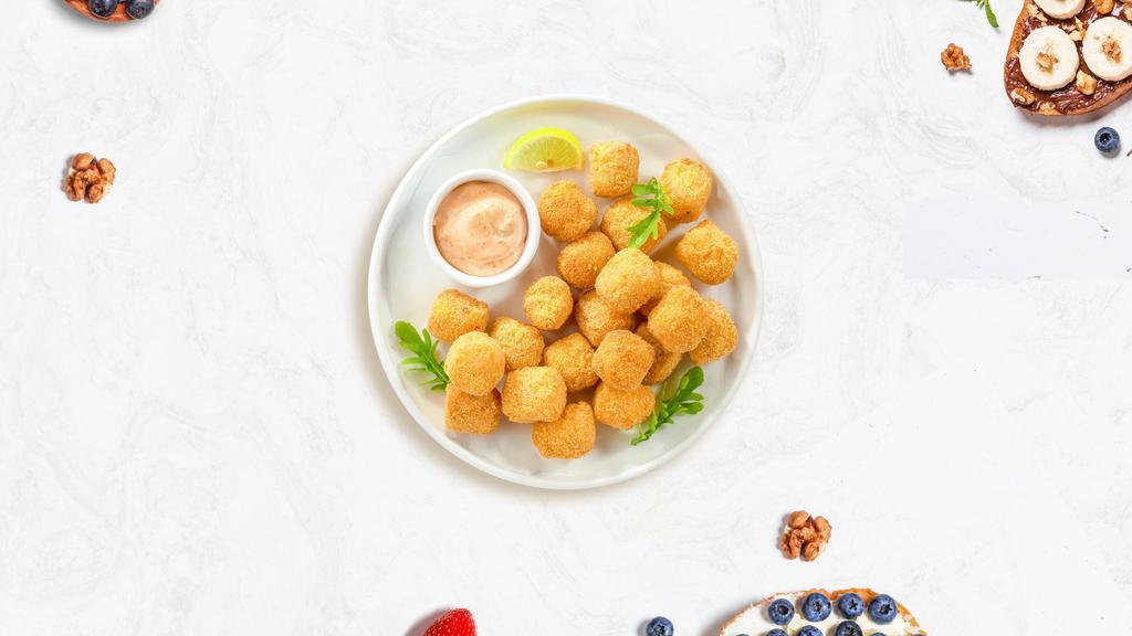 Tot To Ponder · (Vegetarian) Shredded Idaho potatoes formed into tots, battered, and fried until golden brown. Served with your choice of sauce.