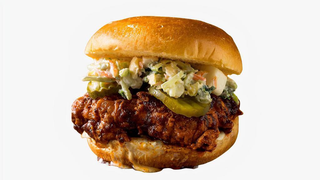 Nashville Hot Fried Chicken Sandwich · Buttermilk fried chicken sandwich with pickles, coleslaw and house spicy sauce. Served with fries.