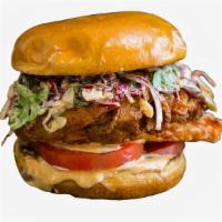 Signature Fried Chicken Sandwich · Buttermilk fried chicken sandwich with slaw, tomatoes, pickles, onions, and a chipotle mayo....